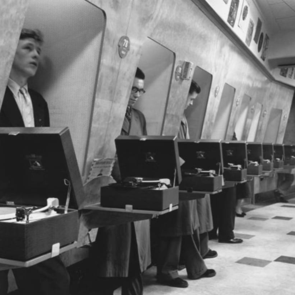 people in listening booths